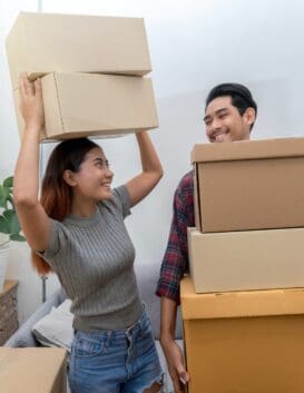 asian-young-couple-carrying-big-cardboard-box-for-moving-in-new-house-moving-and-house.jpg